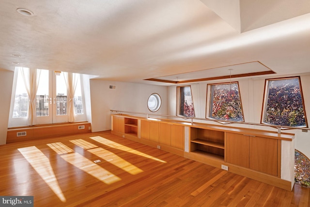 interior space featuring french doors and light wood-type flooring