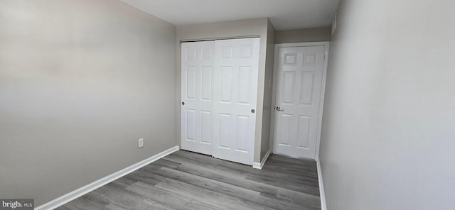 unfurnished bedroom featuring light wood-type flooring