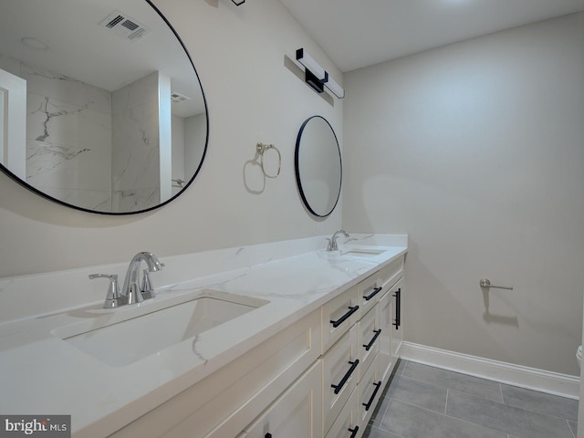 bathroom with tile patterned floors and vanity