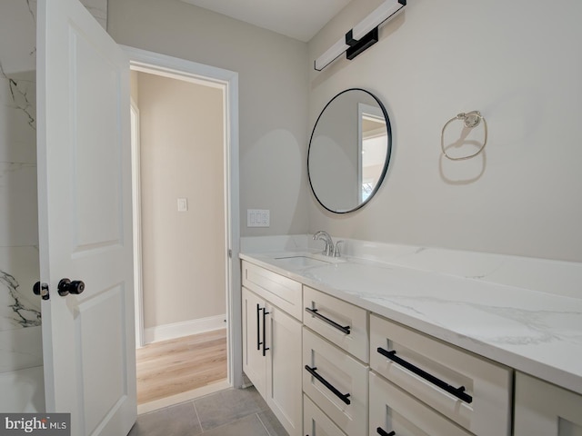 bathroom with tile patterned floors and vanity