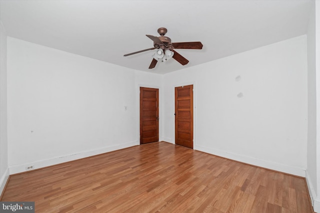 spare room featuring ceiling fan and light wood-type flooring