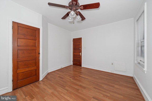 unfurnished bedroom with ceiling fan and light wood-type flooring