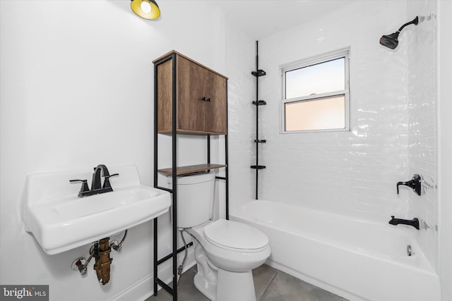 full bathroom with tiled shower / bath combo, sink, and toilet