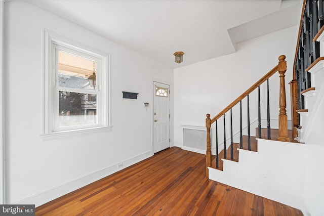 entrance foyer featuring dark hardwood / wood-style floors