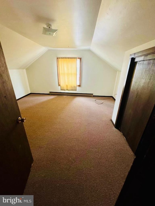 bonus room featuring lofted ceiling, carpet floors, and baseboard heating