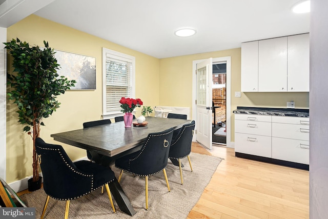 dining area with light hardwood / wood-style floors