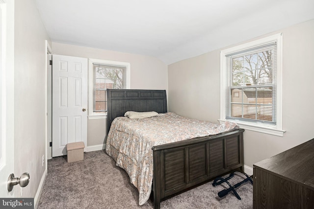 carpeted bedroom featuring vaulted ceiling