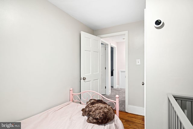 bedroom featuring wood-type flooring