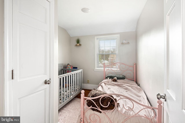 bedroom featuring lofted ceiling