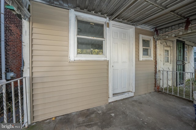 property entrance with a patio