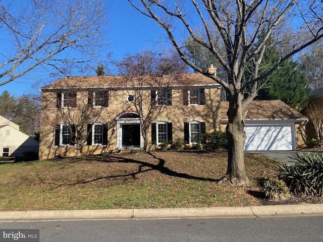 colonial home with a garage