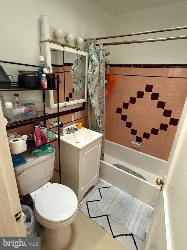 full bathroom with vanity, shower / bath combination with curtain, and toilet