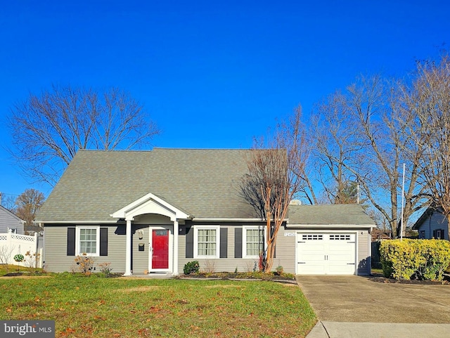 view of front of house with a garage and a front lawn