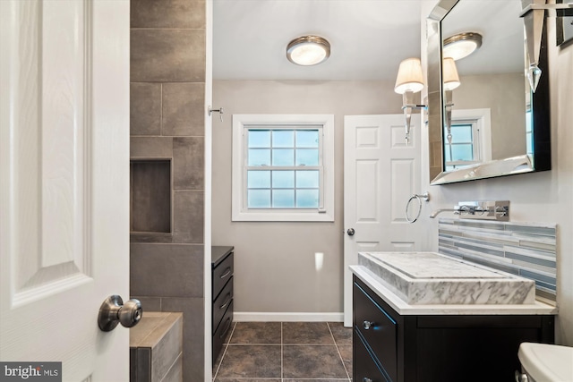 bathroom with vanity and tile patterned flooring