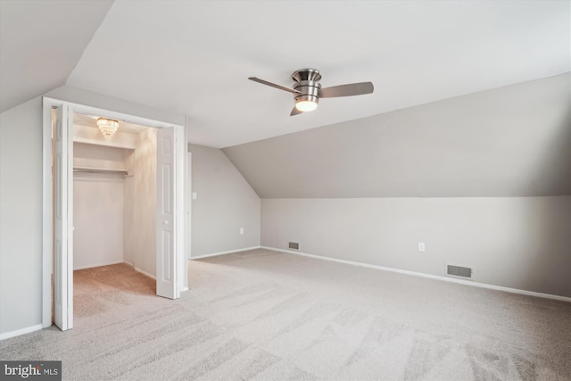 bonus room featuring light carpet, vaulted ceiling, and ceiling fan