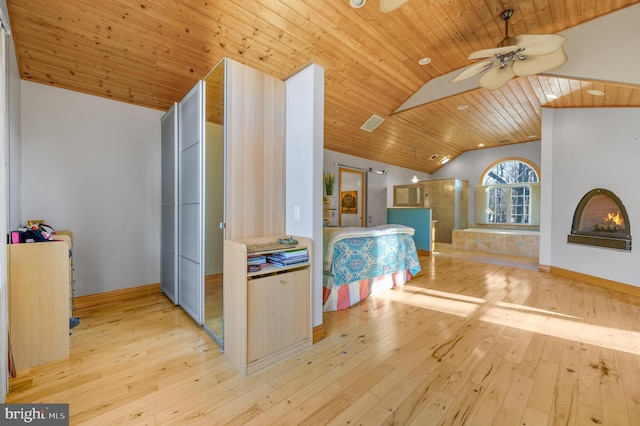 interior space featuring wood ceiling, vaulted ceiling, and light wood-type flooring