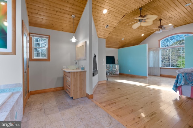 bathroom with wood ceiling, vanity, ceiling fan, wood-type flooring, and lofted ceiling