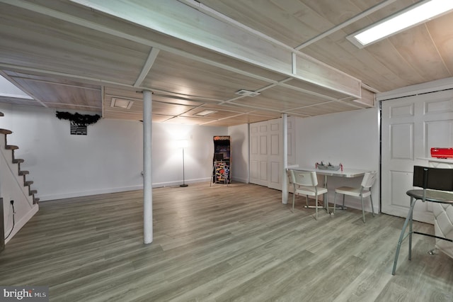 basement with hardwood / wood-style floors