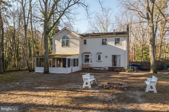 back of house featuring a sunroom