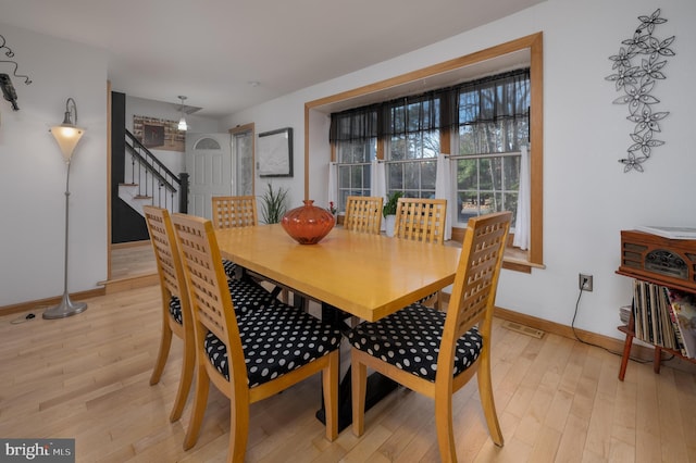 dining area featuring light wood-type flooring