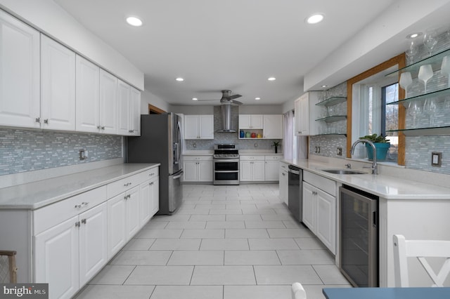 kitchen with white cabinetry, sink, stainless steel appliances, wine cooler, and backsplash