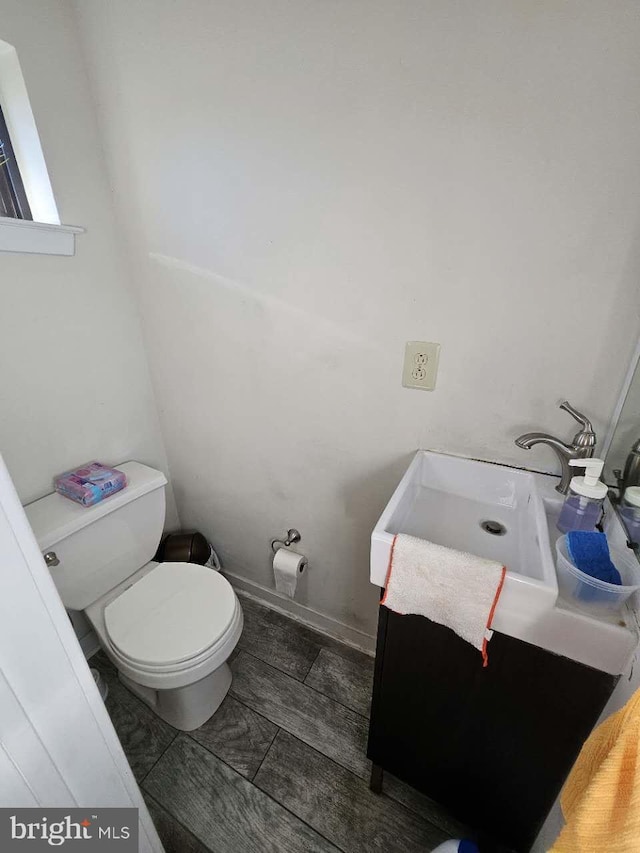 bathroom featuring sink and toilet