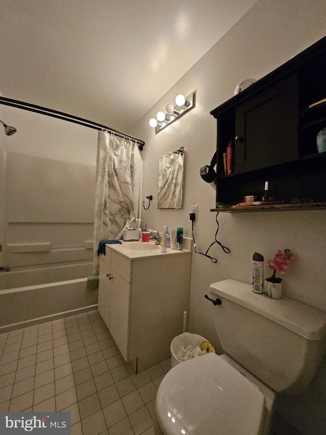 full bathroom featuring tile patterned flooring, vanity, toilet, and shower / tub combo with curtain