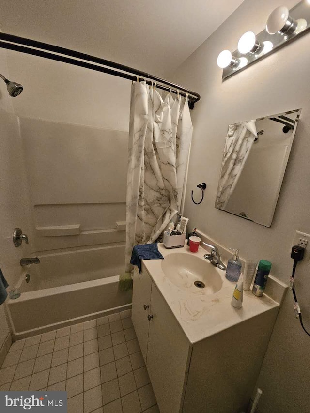 bathroom with tile patterned flooring, vanity, and shower / tub combo with curtain