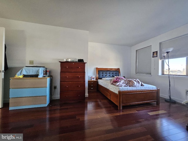 bedroom featuring dark hardwood / wood-style flooring