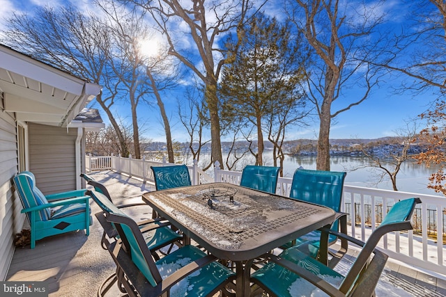 wooden terrace featuring a water view