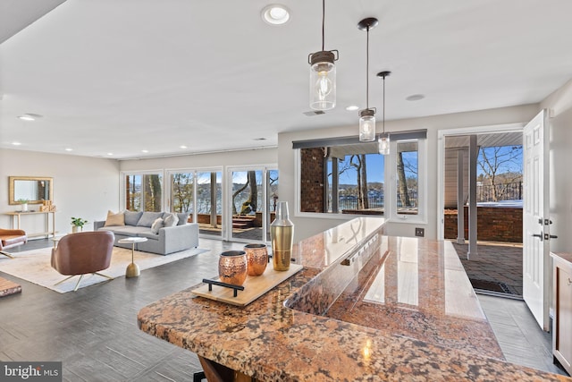 kitchen featuring stone counters and decorative light fixtures