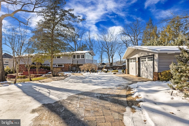 exterior space with an outbuilding and a garage