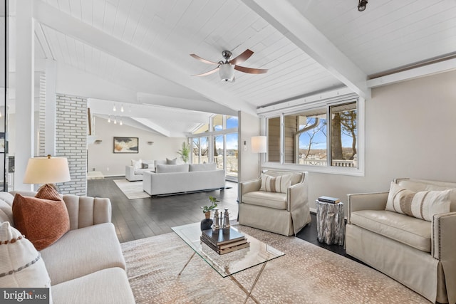 living room with hardwood / wood-style flooring, ceiling fan, and lofted ceiling with beams