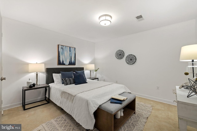 bedroom featuring light carpet