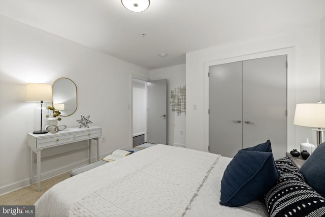 carpeted bedroom featuring a closet