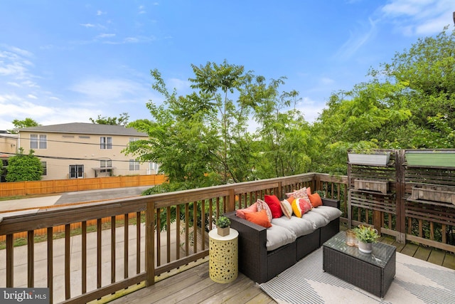 deck featuring outdoor lounge area