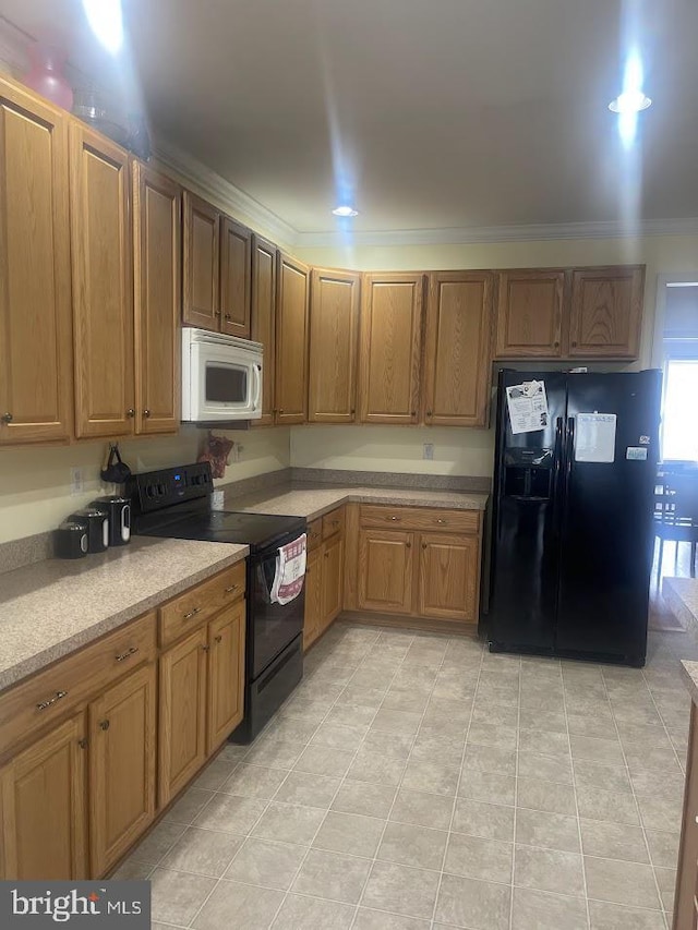 kitchen with ornamental molding and black appliances