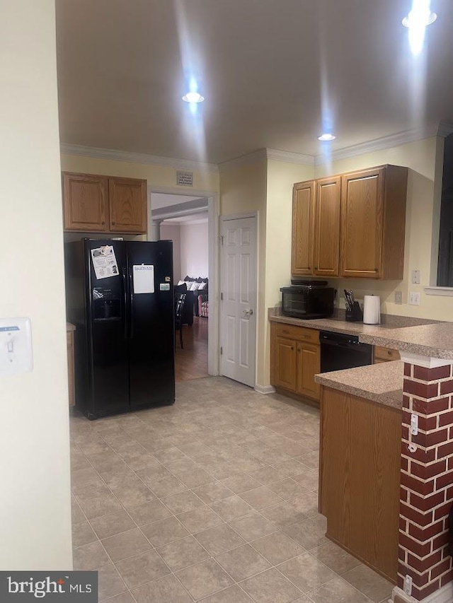 kitchen featuring black appliances and ornamental molding