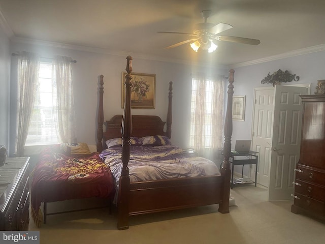 bedroom with ceiling fan, light carpet, and ornamental molding