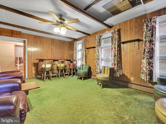 living room featuring beam ceiling, carpet floors, ceiling fan, and a baseboard heating unit