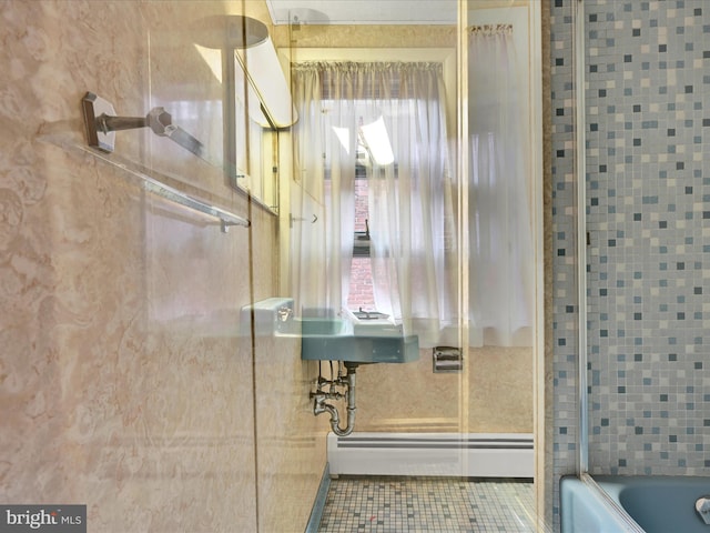 bathroom with tile patterned floors, bathing tub / shower combination, and a baseboard radiator