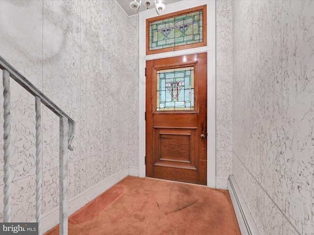 doorway to property featuring a baseboard heating unit