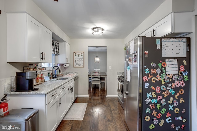 kitchen with white cabinetry, sink, and stainless steel appliances