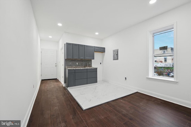 2808 Germantown Ave, Philadelphia, PA 19133 - kitchen with gray cabinets, dark wood-style floors, decorative backsplash, recessed lighting, and light stone counters