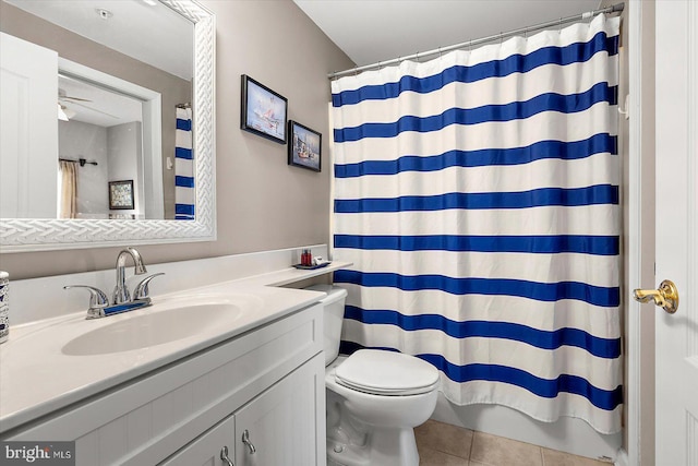 bathroom featuring tile patterned floors, vanity, toilet, and walk in shower