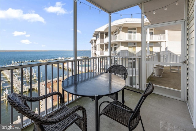 balcony featuring a water view