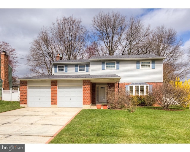 view of property with a garage and a front lawn