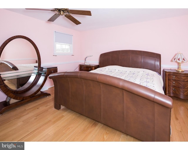 bedroom with ceiling fan and light wood-type flooring