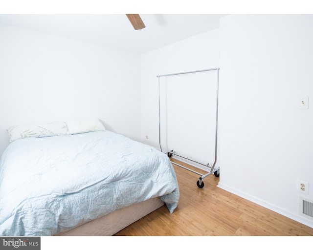 bedroom featuring ceiling fan and hardwood / wood-style floors