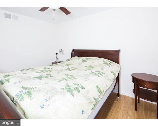 bedroom with ceiling fan and light wood-type flooring